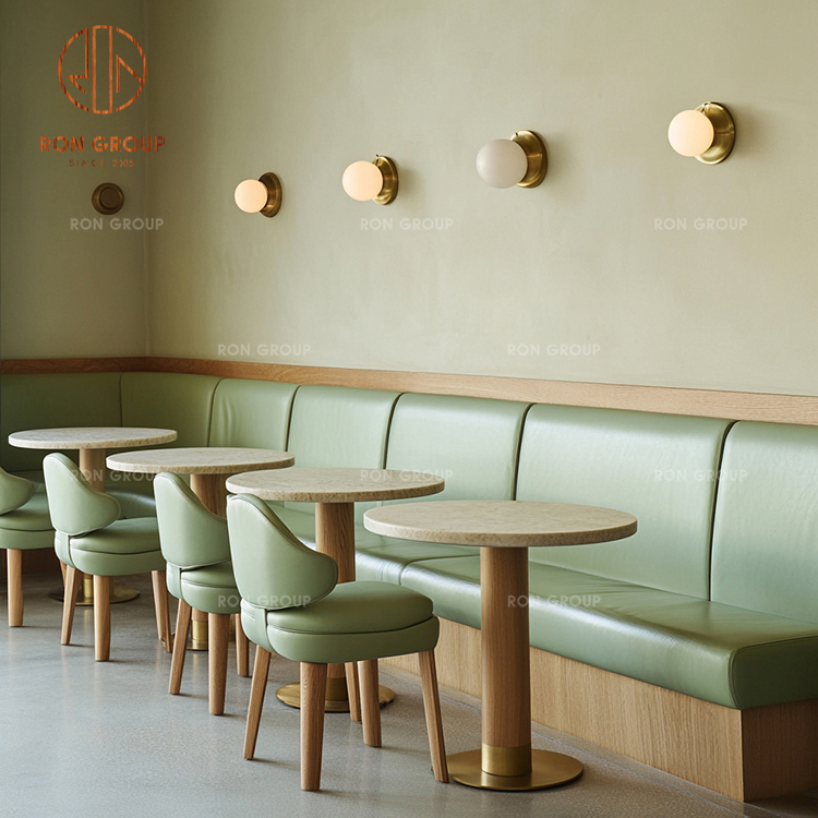 Luxury Cafe Booth Seating with Green Leather Sofa and Marble Round Tables