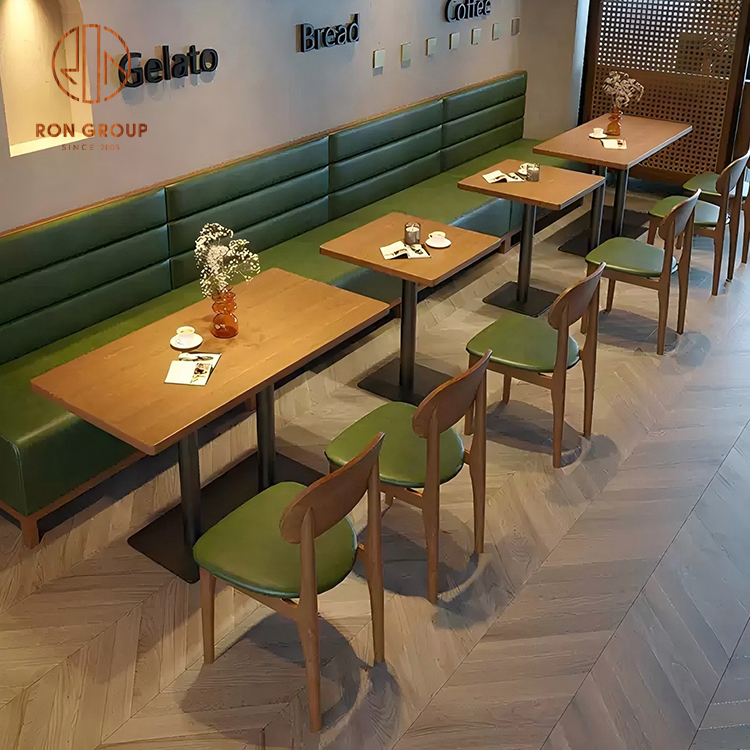 Modern Cafe Booth Seating with Green Upholstered Sofa and Wooden Dining Tables