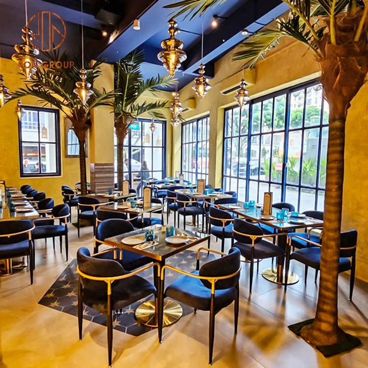 Marble Top Dining Tables with Gold Trim and Navy Velvet Chairs for Luxury Restaurant Spaces