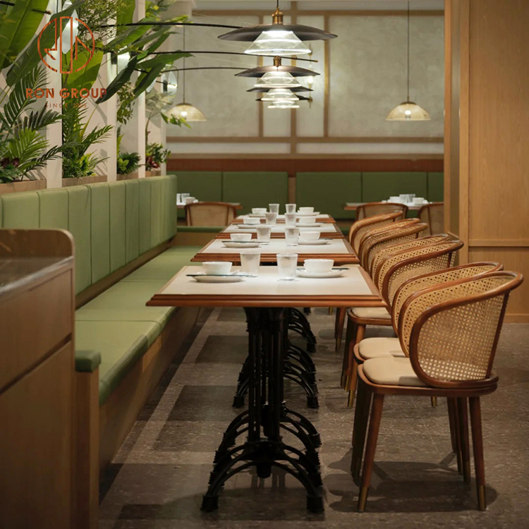Modern Wood Dining Tables with Green Fabric Booth Seating and Rattan Cafe Chairs