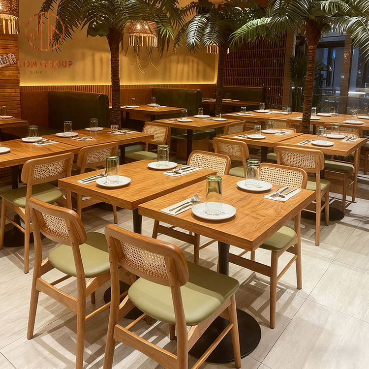 Cafe Booth Seating Set with Green Leather Sofa, Wooden Tables and Rattan Chairs